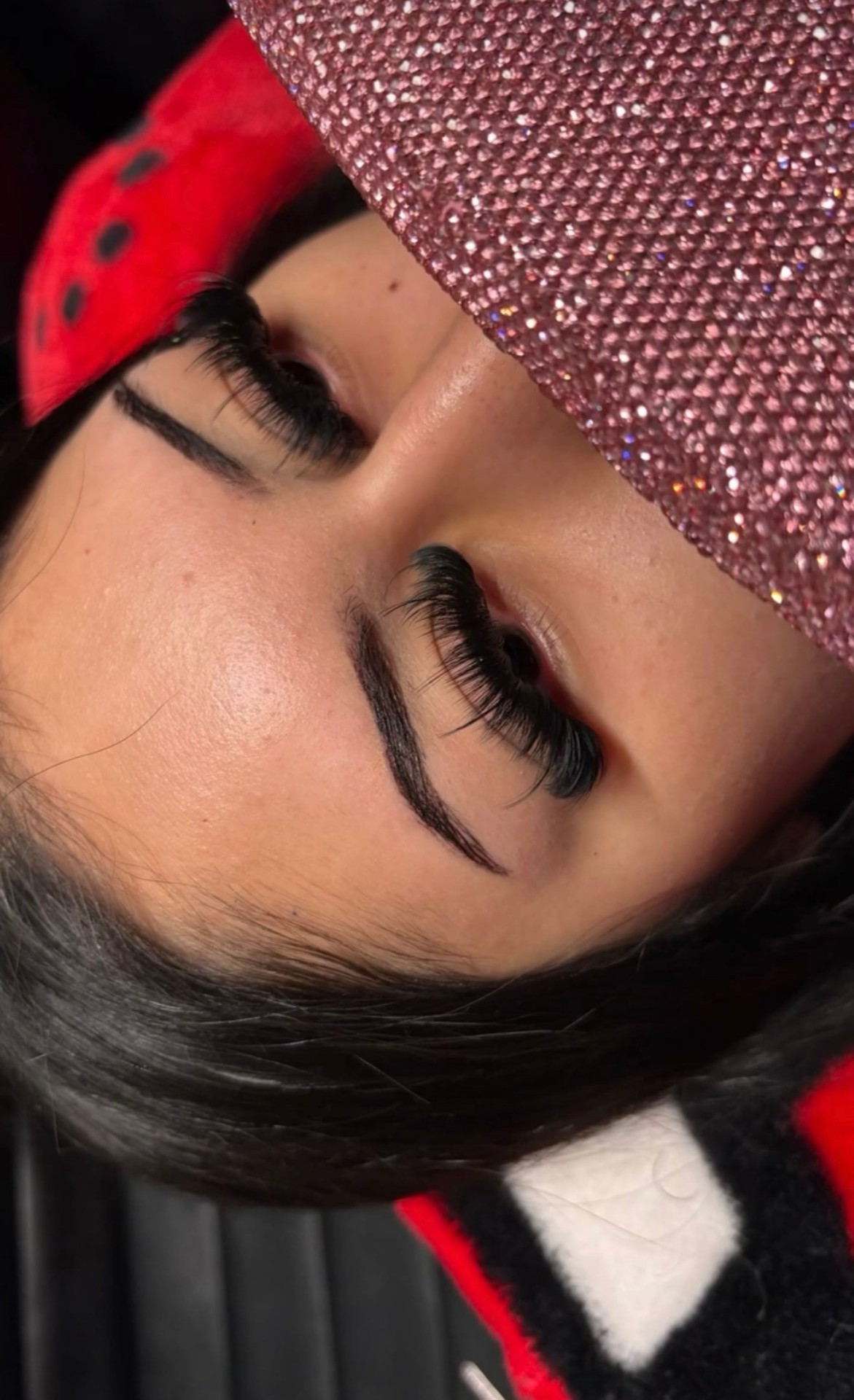 Wispy hybrid lash extensions with soft curl on brown eye — Exotic Blinkzz client